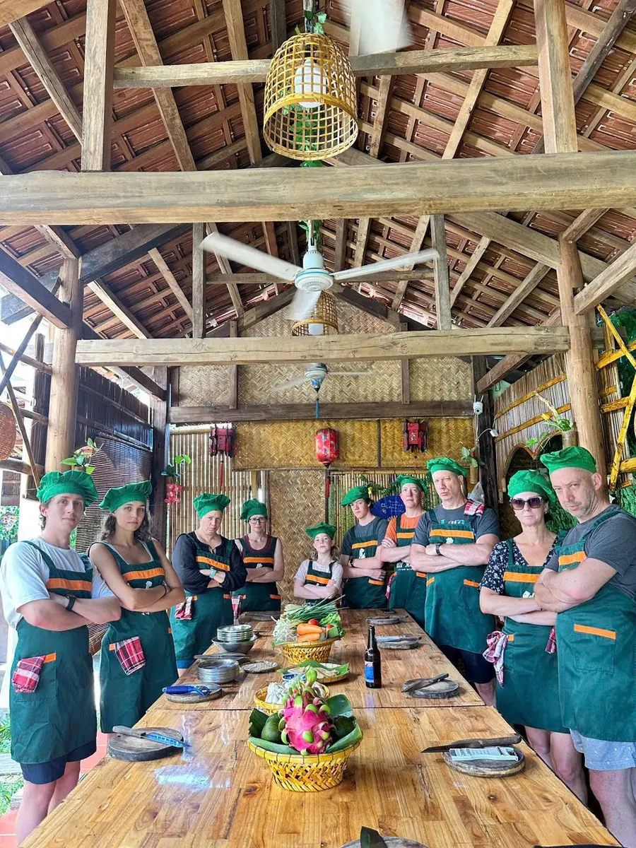 Our local chef and happy guests cooking together at Long’s Family