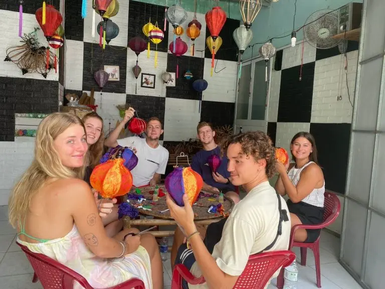Guests with the colourful lanterns they have made