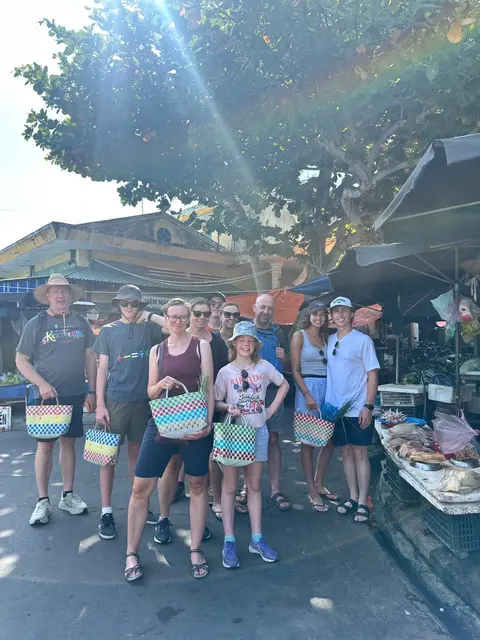 Our guests with baskets at the local market